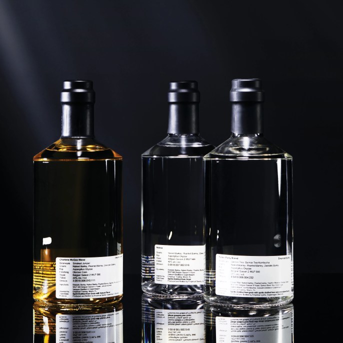 three empirical spirits bottles side by side