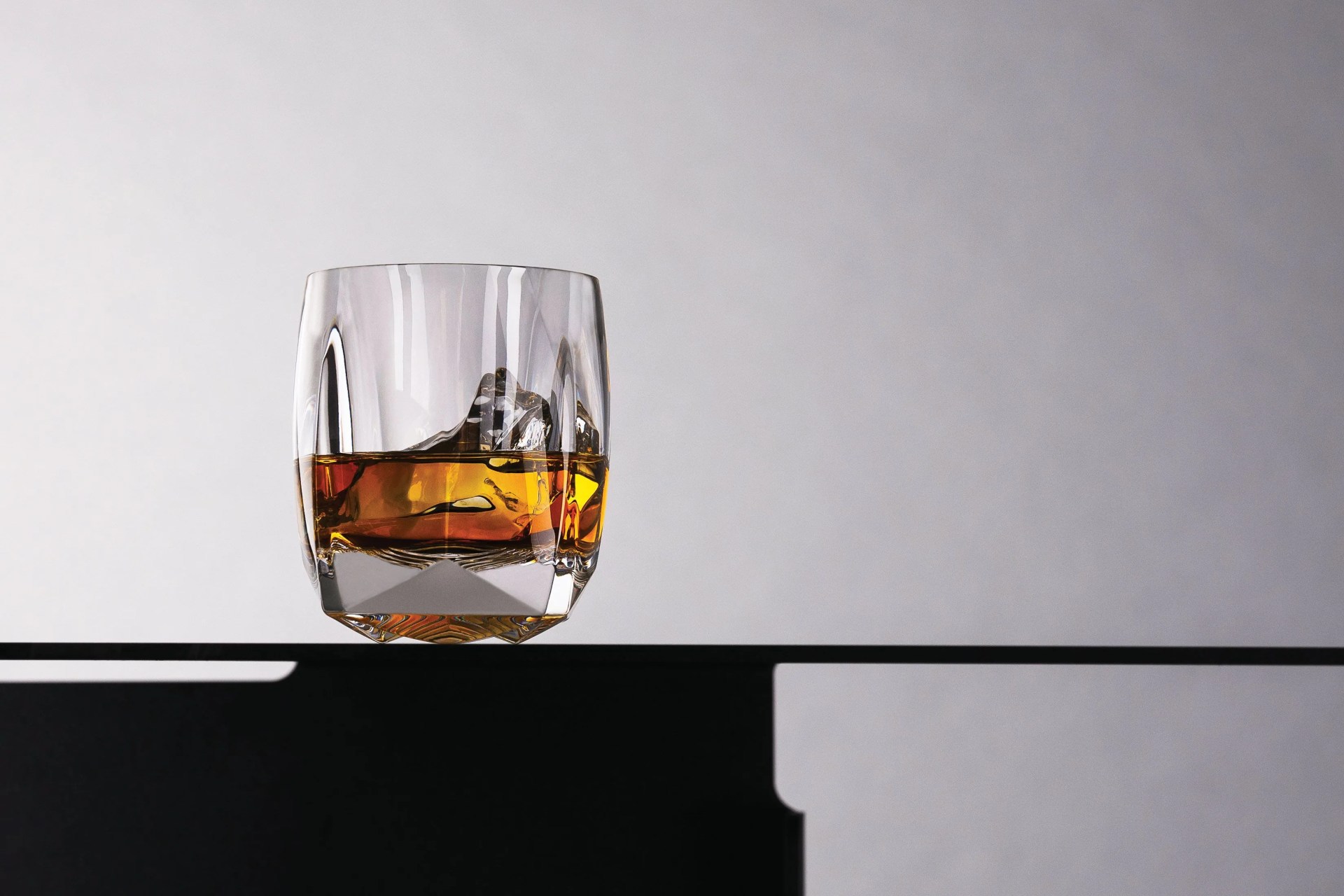 norlan whiskey glass, half full