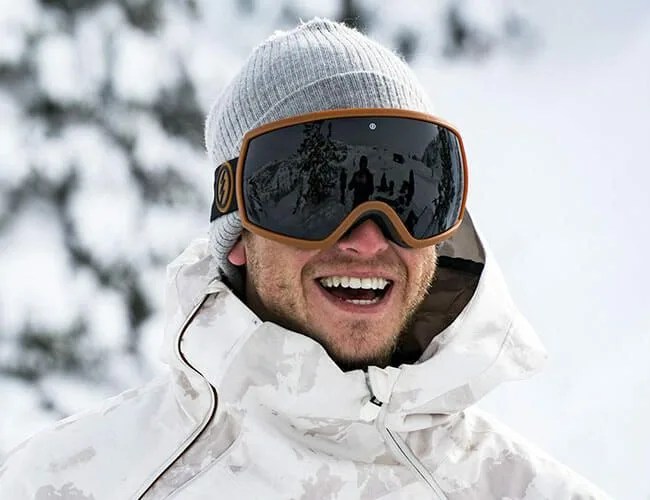 man wearing snow goggles in the snow