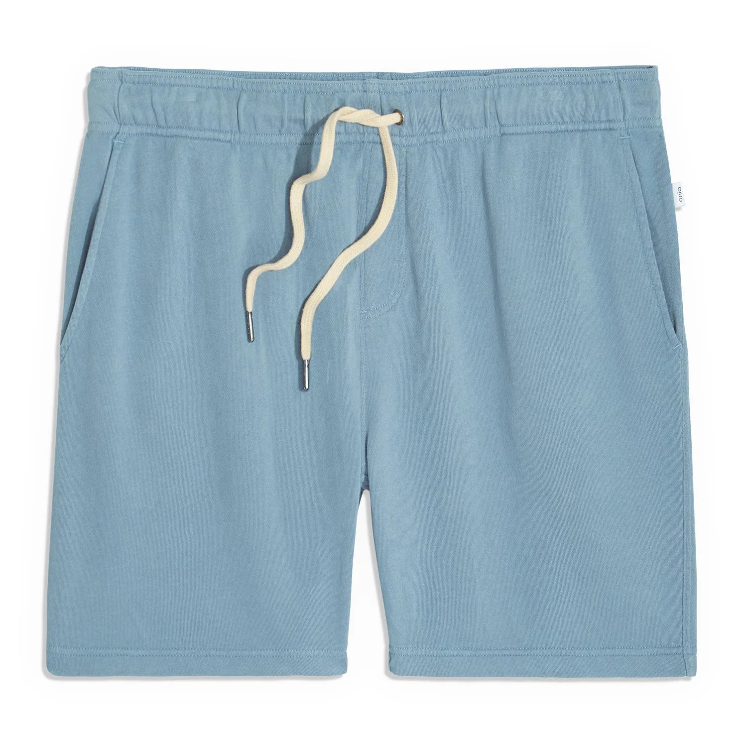 Blue sweatshorts on a gray background.