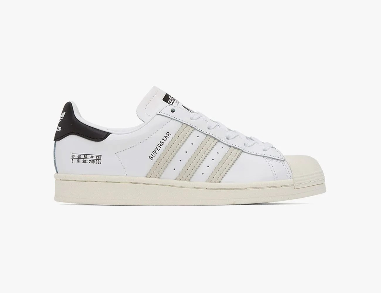 white adidas sneakers on white background