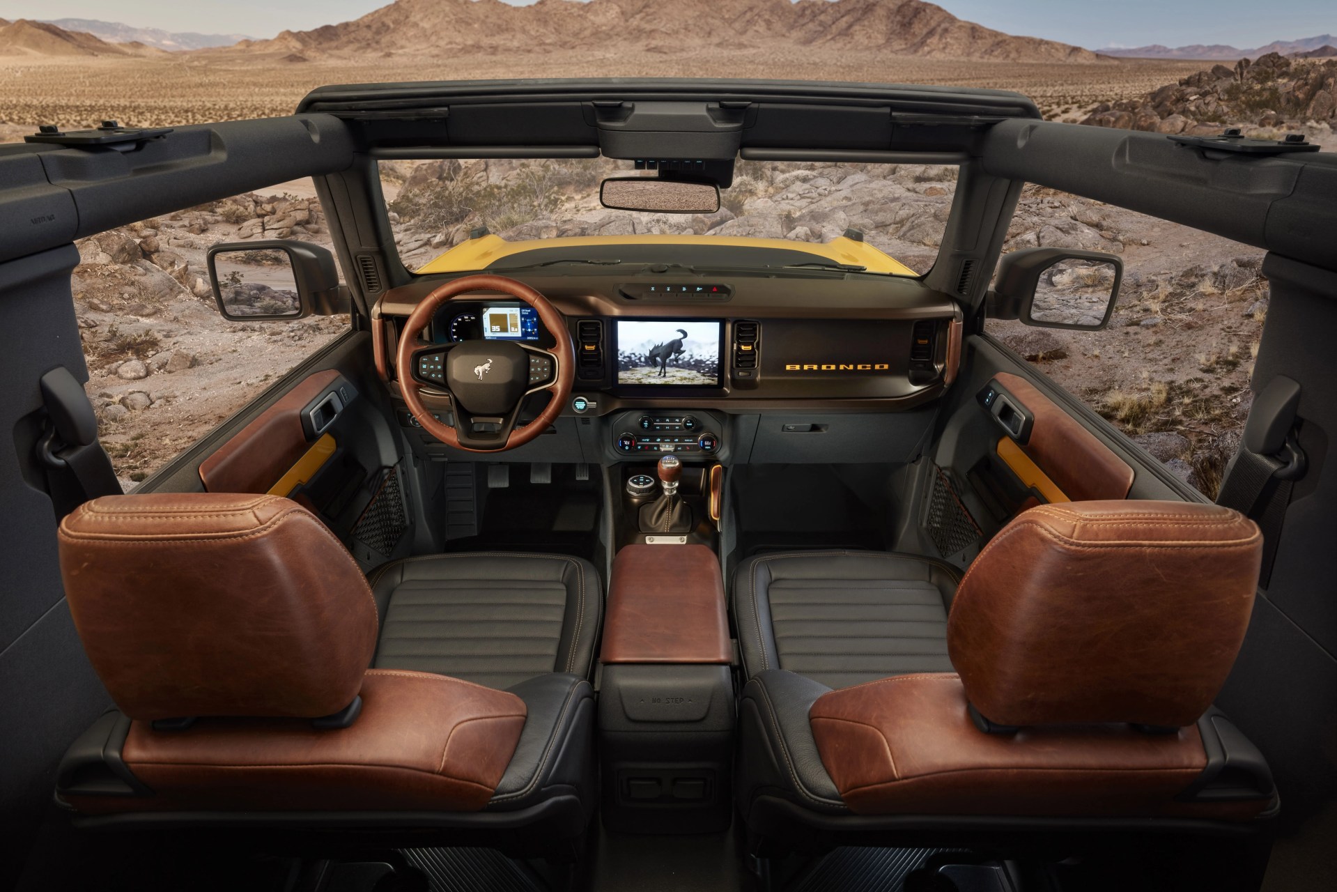 2021 bronco two door features class leading open air design roof and instrument panel inspired by the first generation bronco, with intuitive, clearly visible gauges and controls in this prototype version not representative of production model prototype not representative of production model&nbsp;static display on private property with aftermarket accessories not available for sale