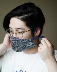 model wearing blue and white face mask