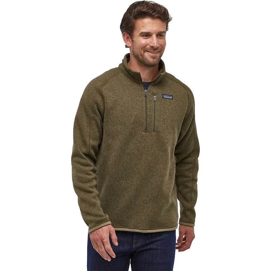 A green fleece pullover on a model with blue jeans on a white background.