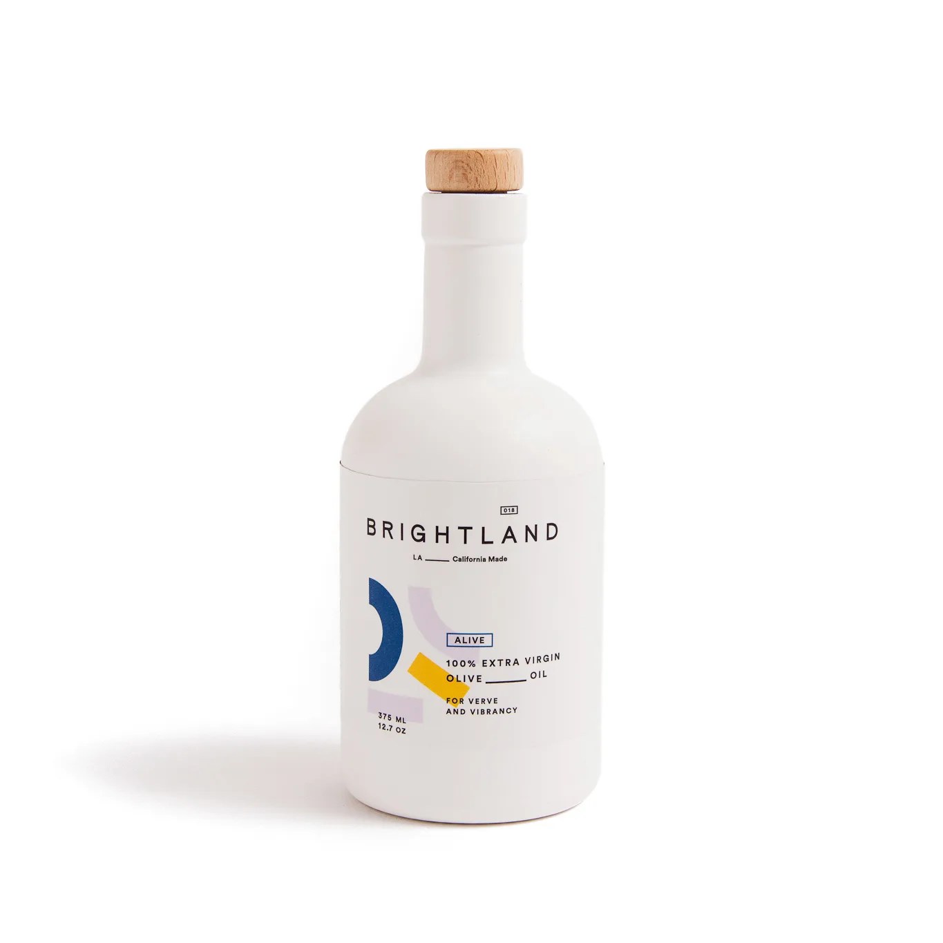 A white bottle of olive oil on a gray background.
