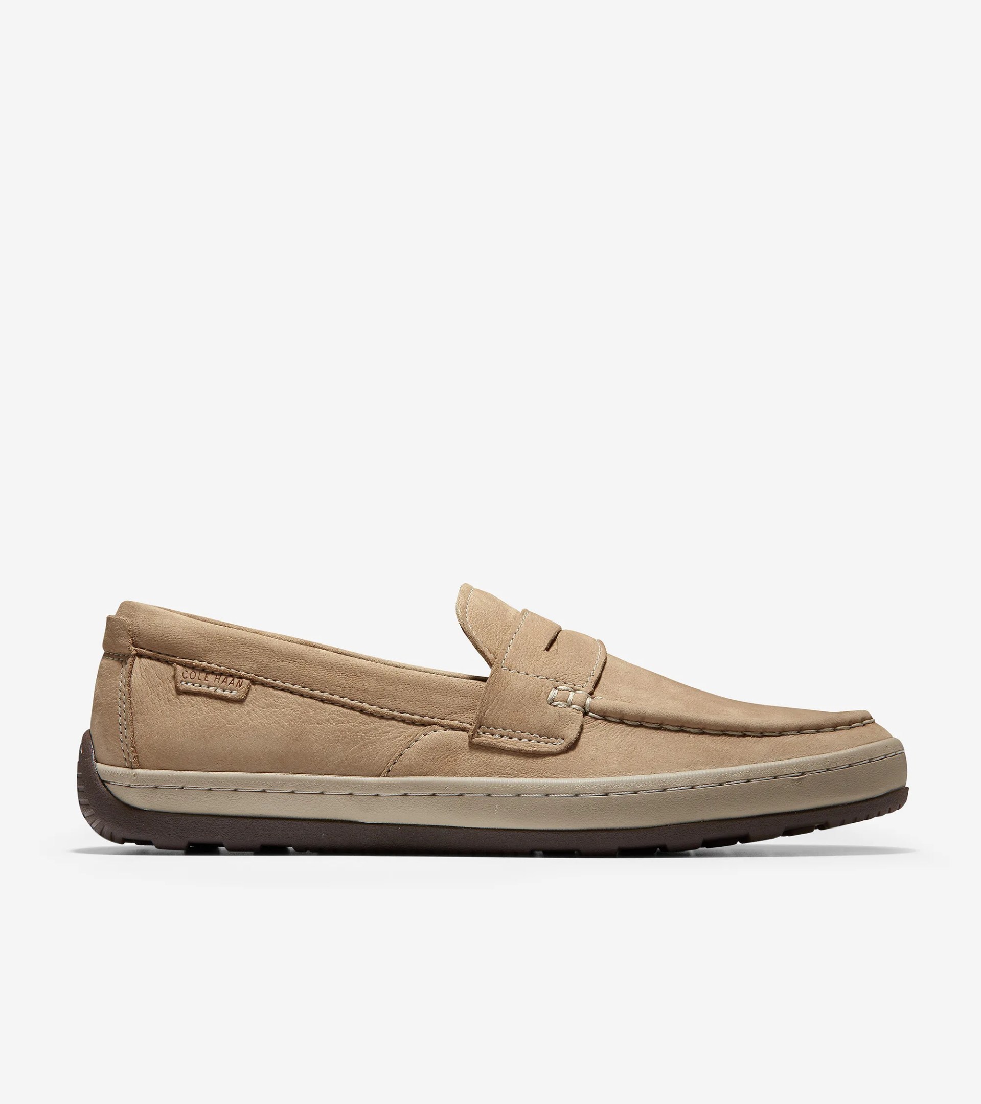 A tan sneaker penny loafer hybrid shoe on a gray background.