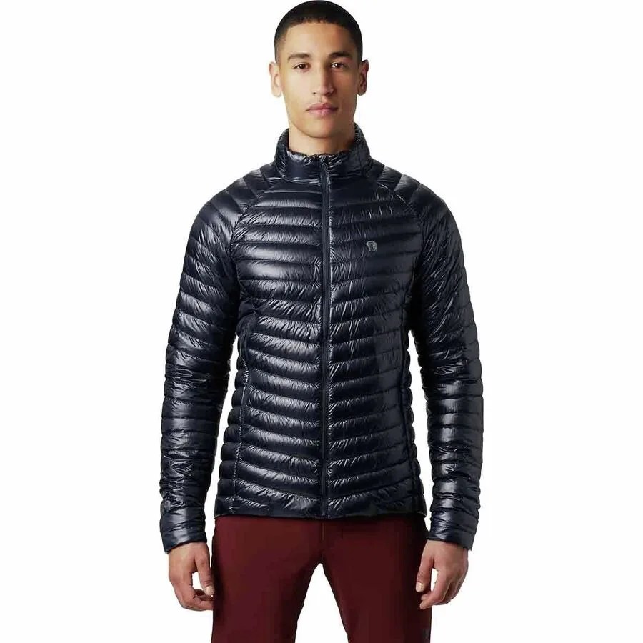 A dark blue insulated jacket on a model on a gray background.