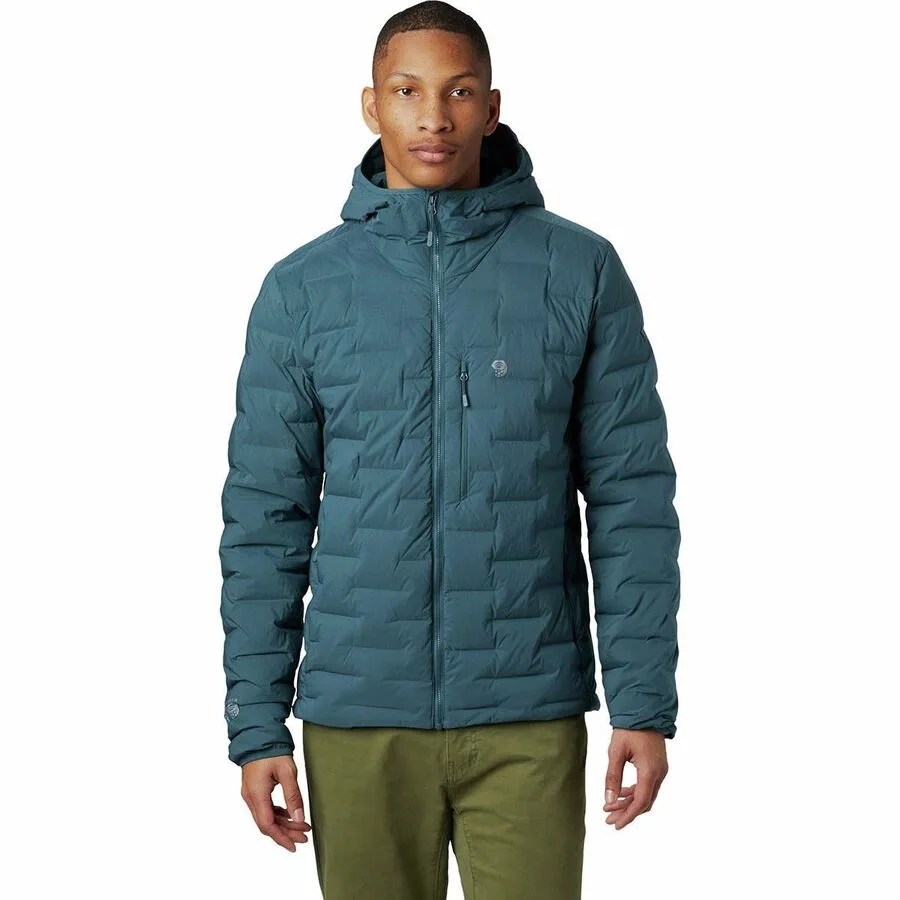 a man wearing a gray-blue down jacket
