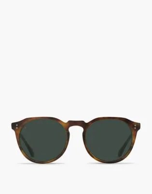 Brown multi sunglasses on a gray background.