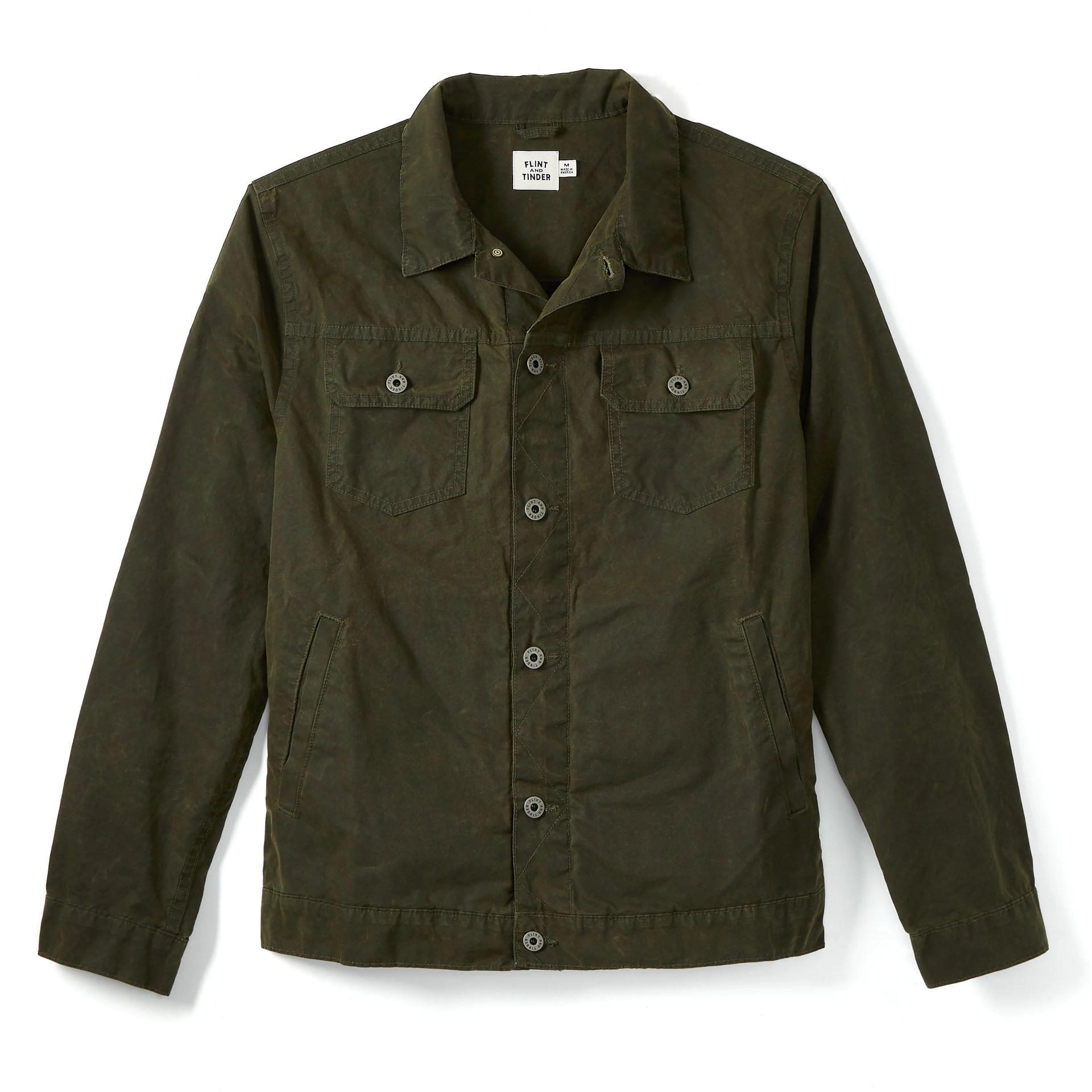 A dark green trucker jacket on a gray background.