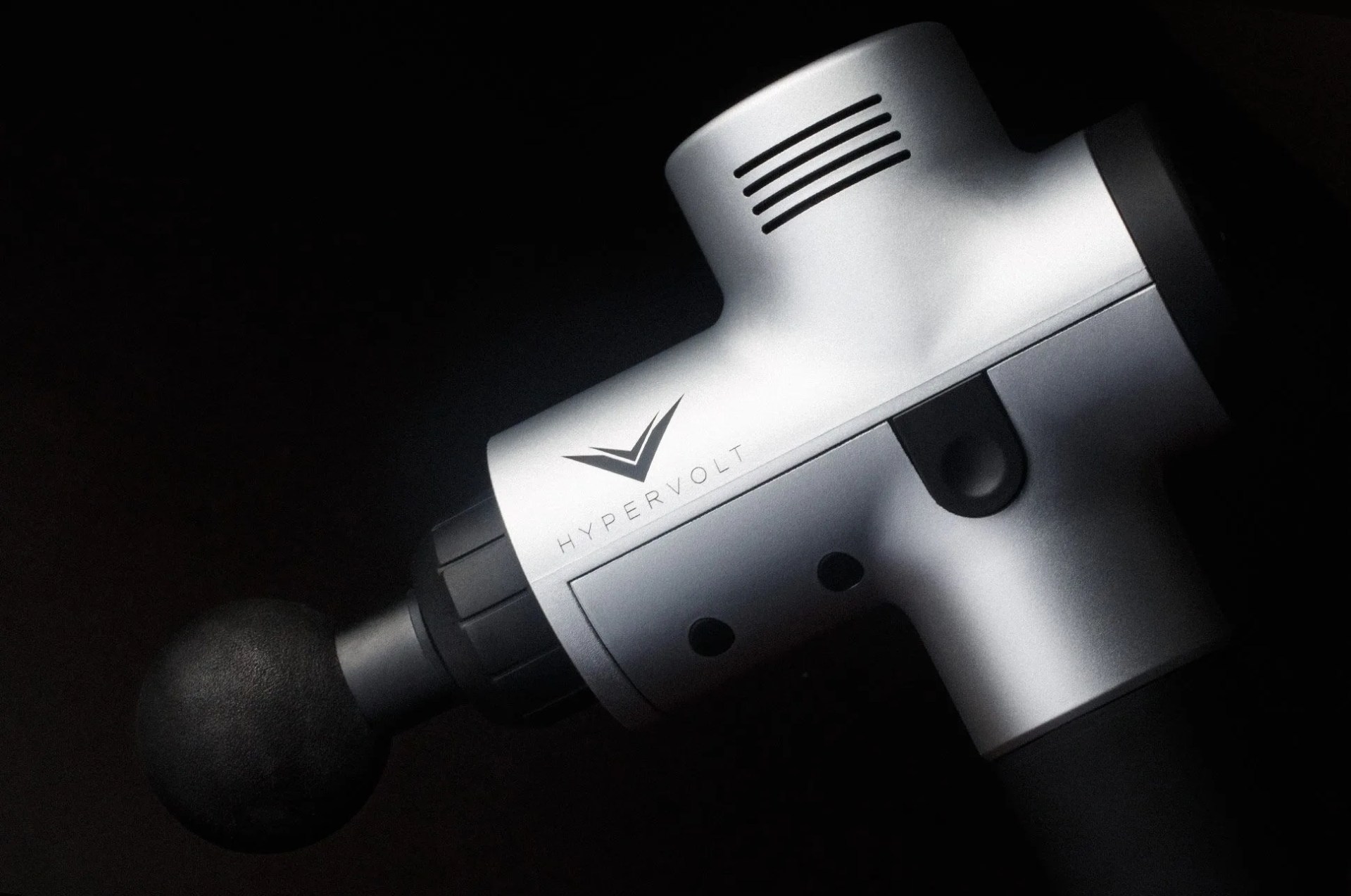 a close up of a percussion massage gun