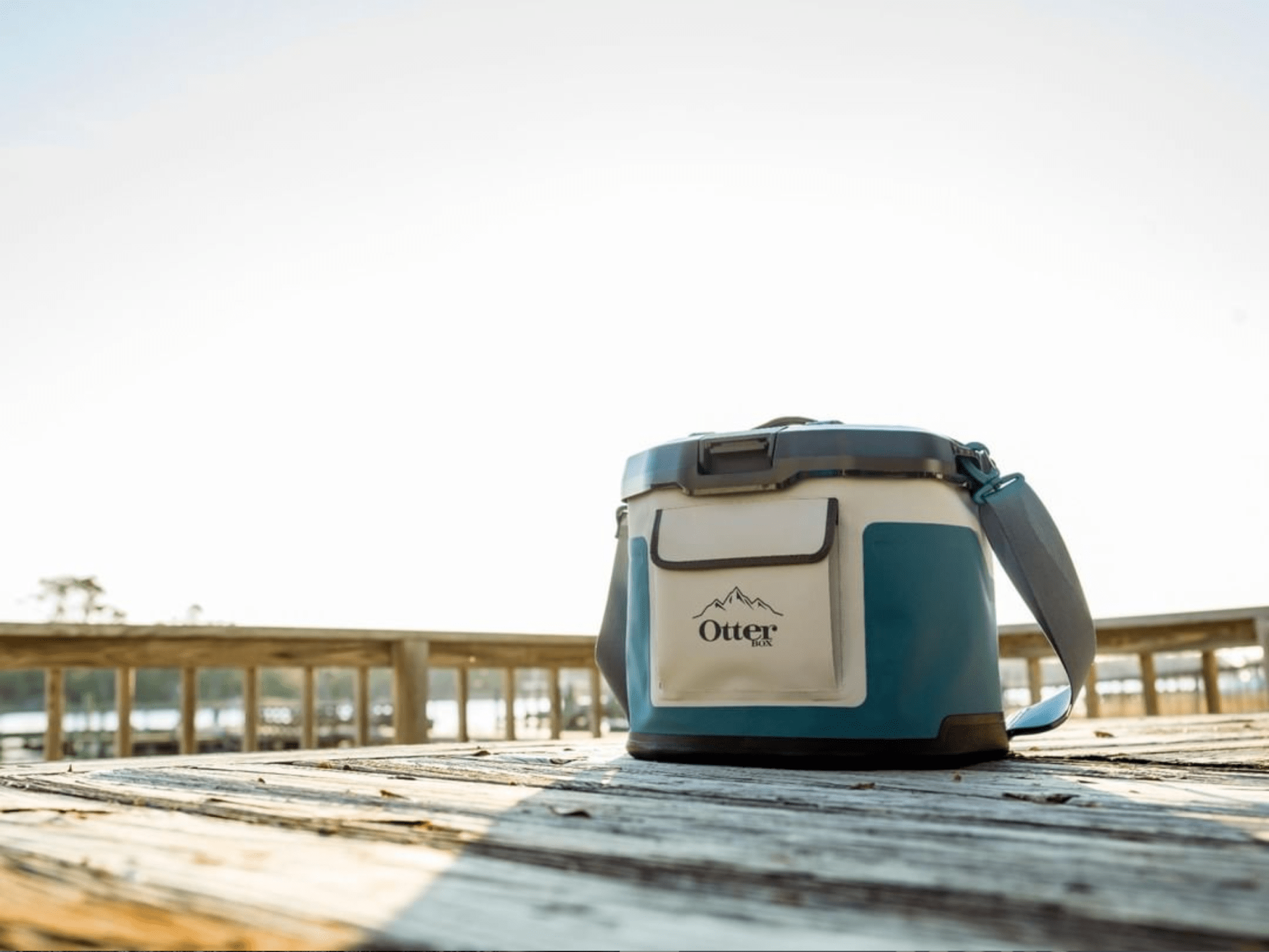 a soft cooler on a picnic table