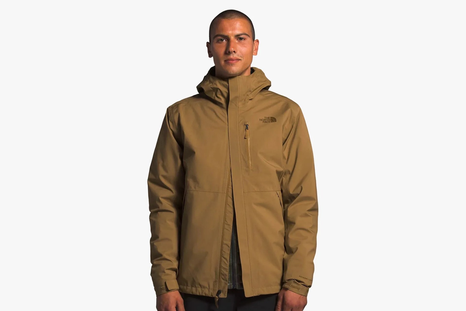 a man wearing a light brown jacket