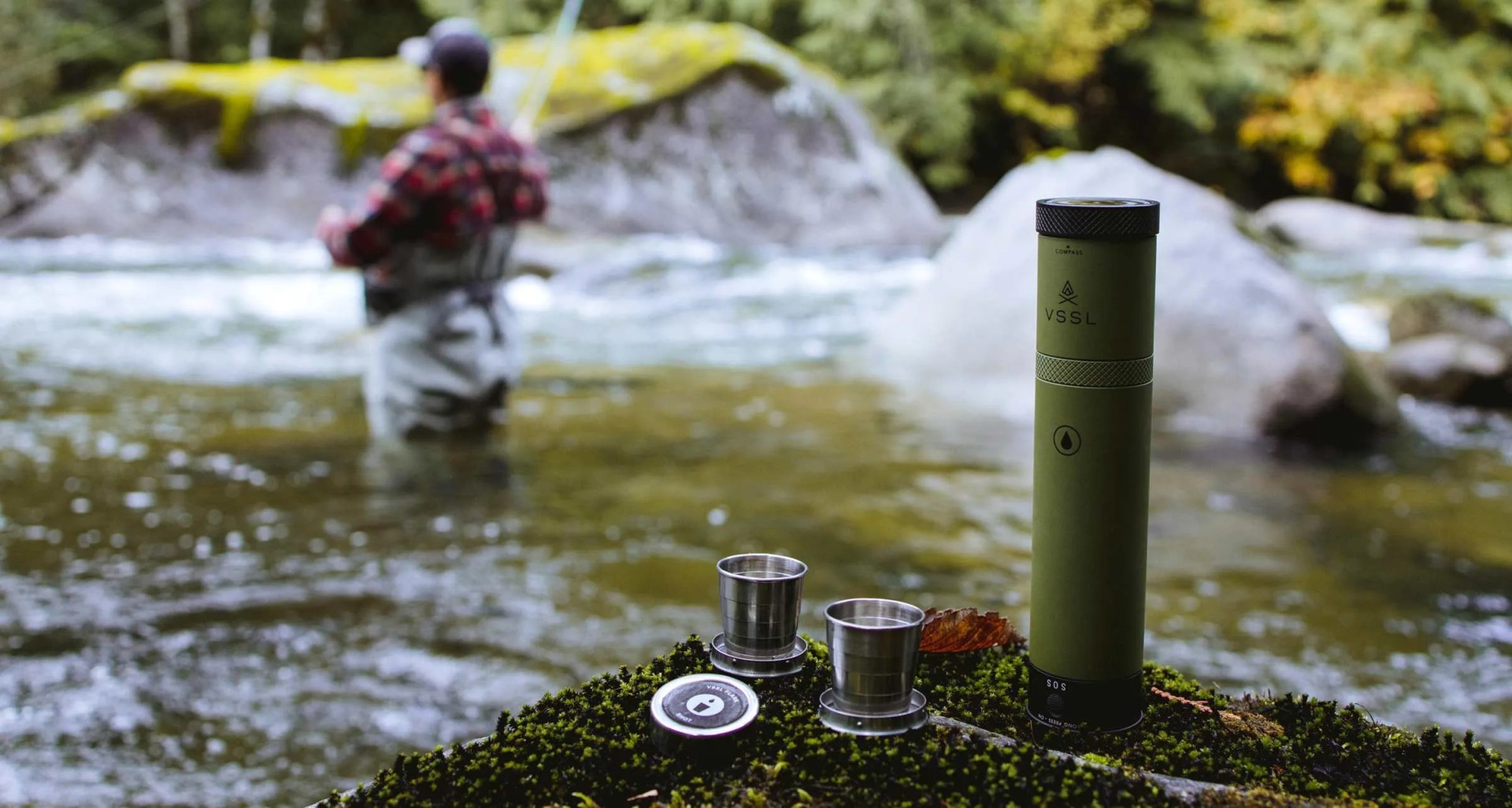 a flask with two concealed shot glasses and a fisherman