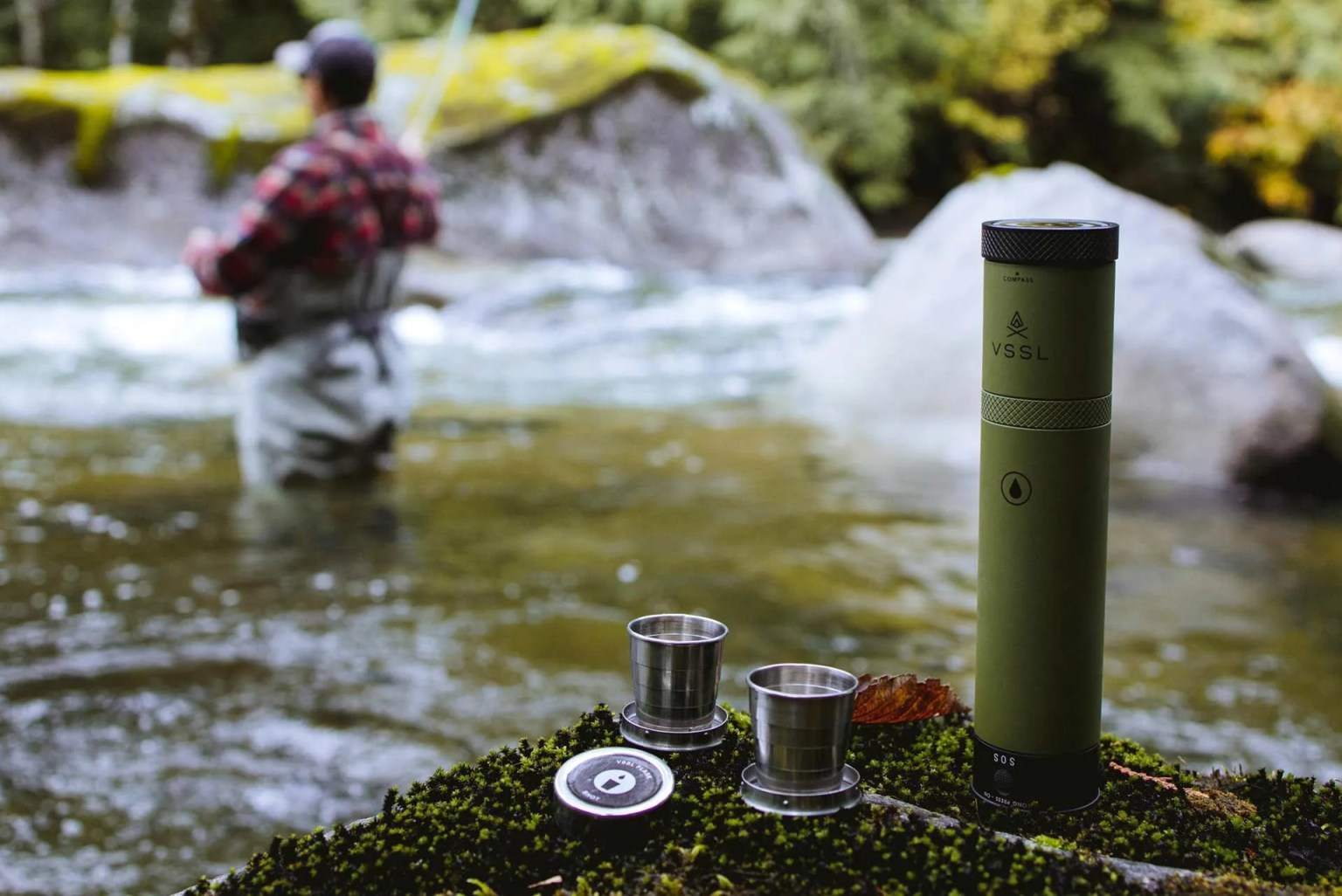 a flask with two concealed shot glasses and a fisherman