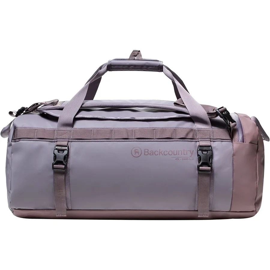 A gray duffel bag on a gray background.
