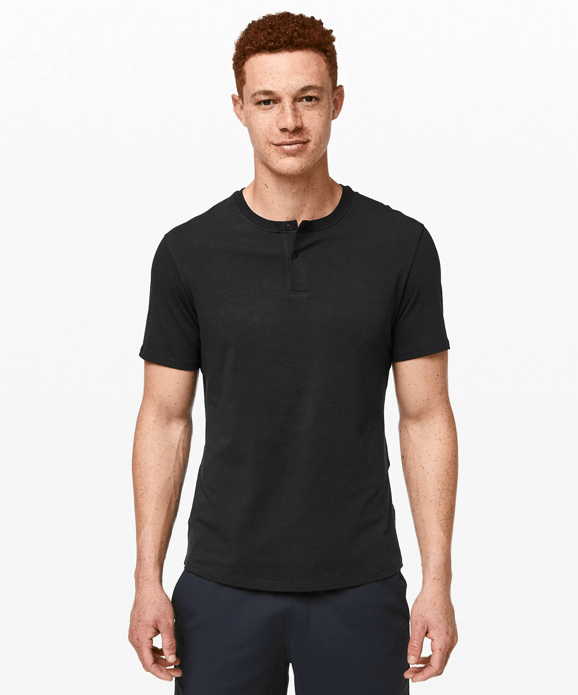A model wearing a black short sleeve henley