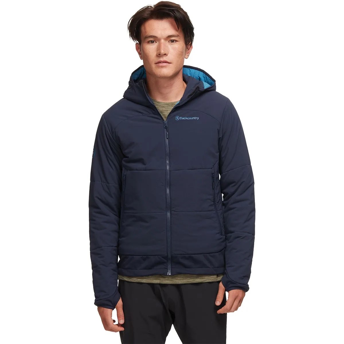 A model wearing a blue insulated jacket