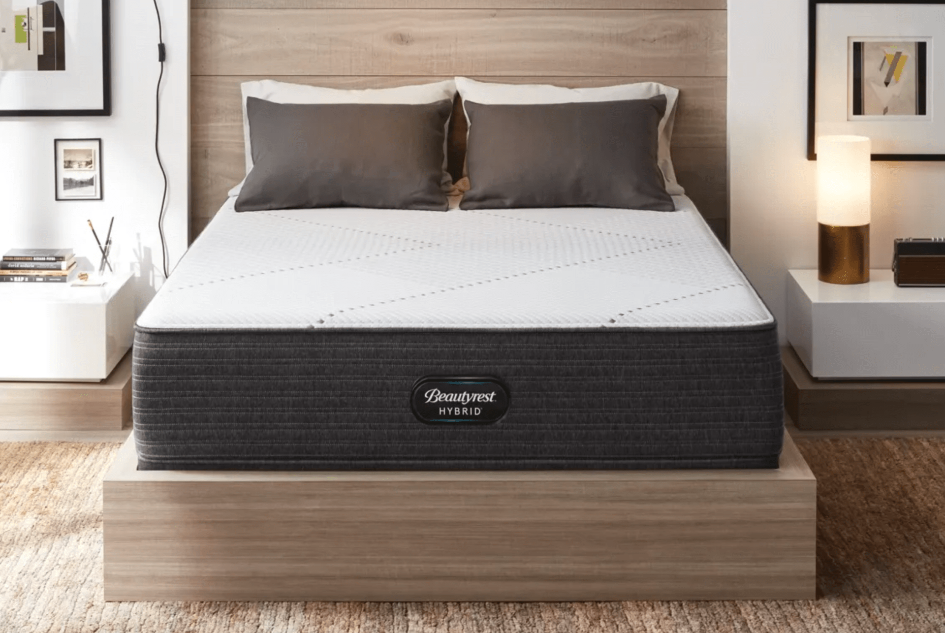 a bedroom with a mattress, platform bed and art