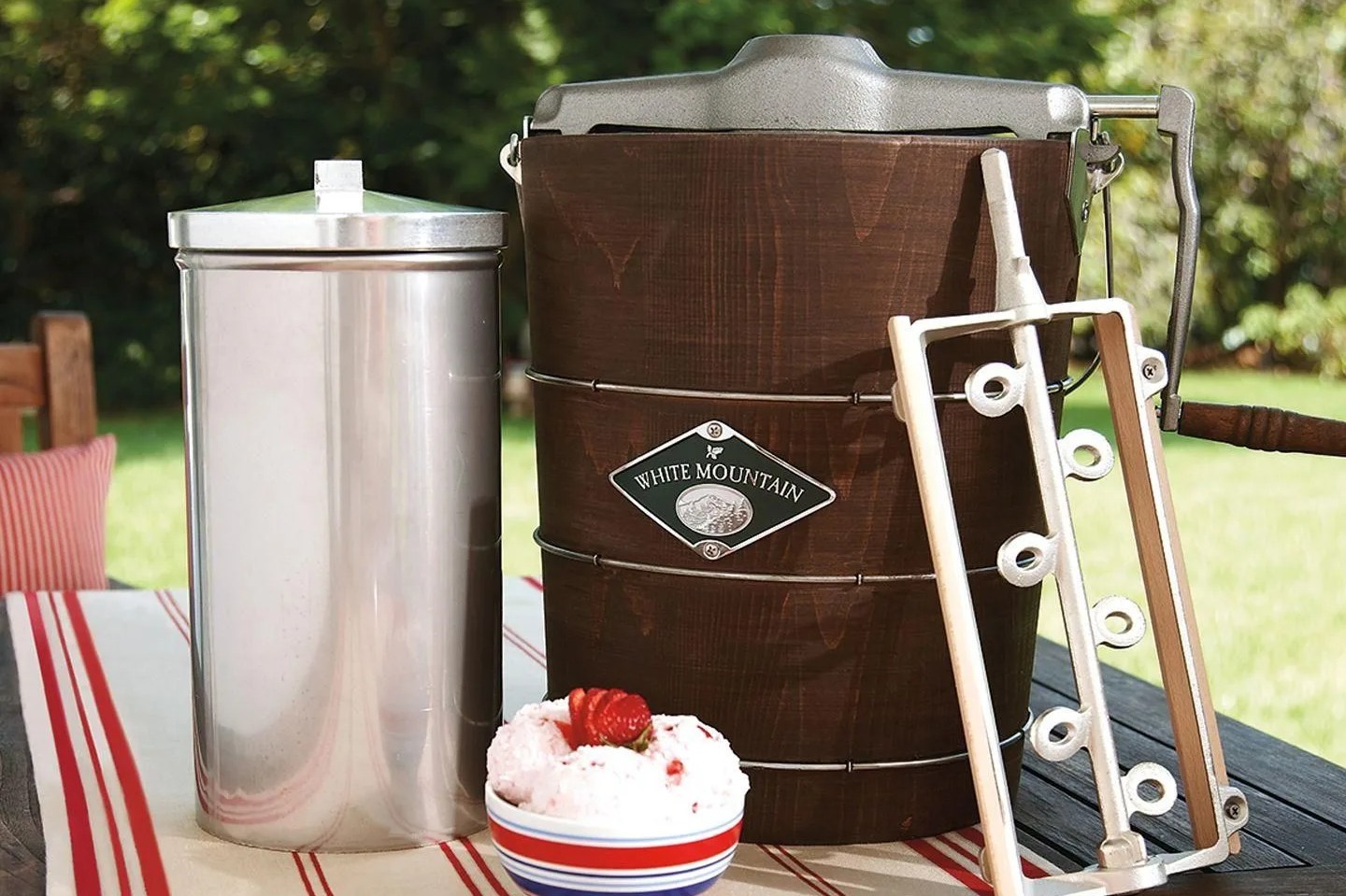 hand crank ice cream maker with bowl of ice cream