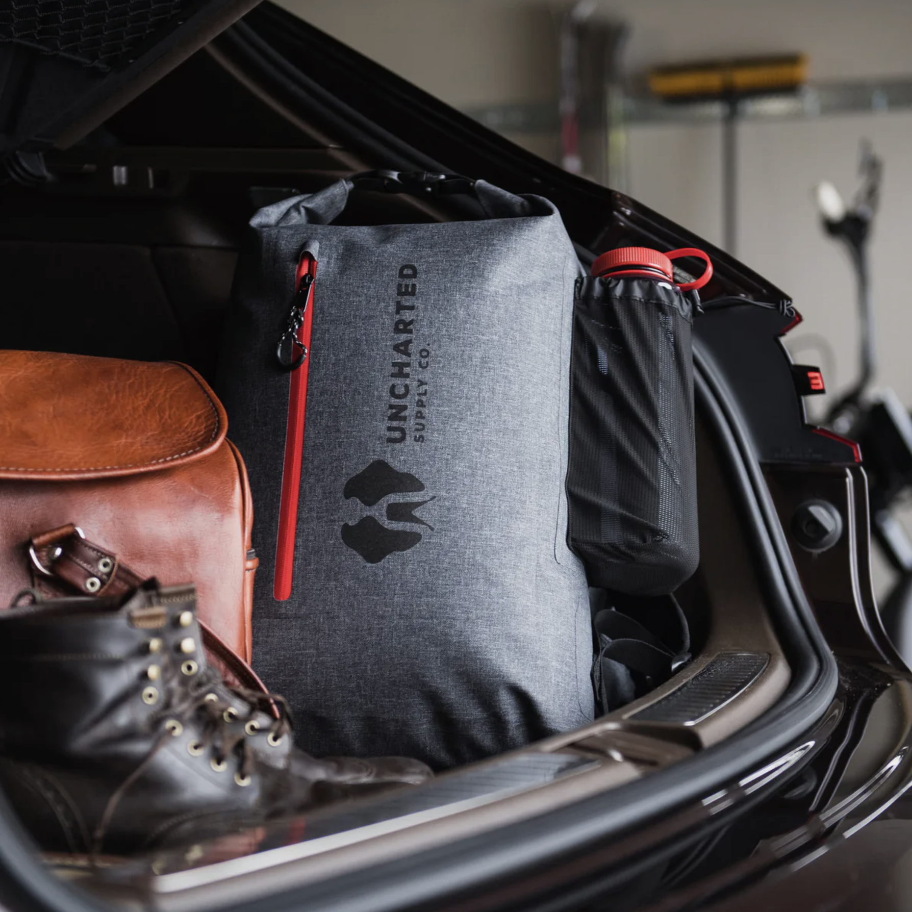 a survival bag in the back of a car