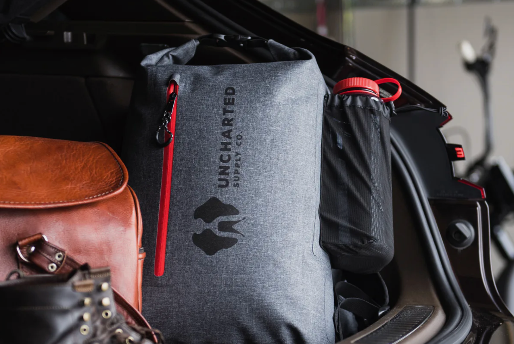 a survival bag in the back of a car