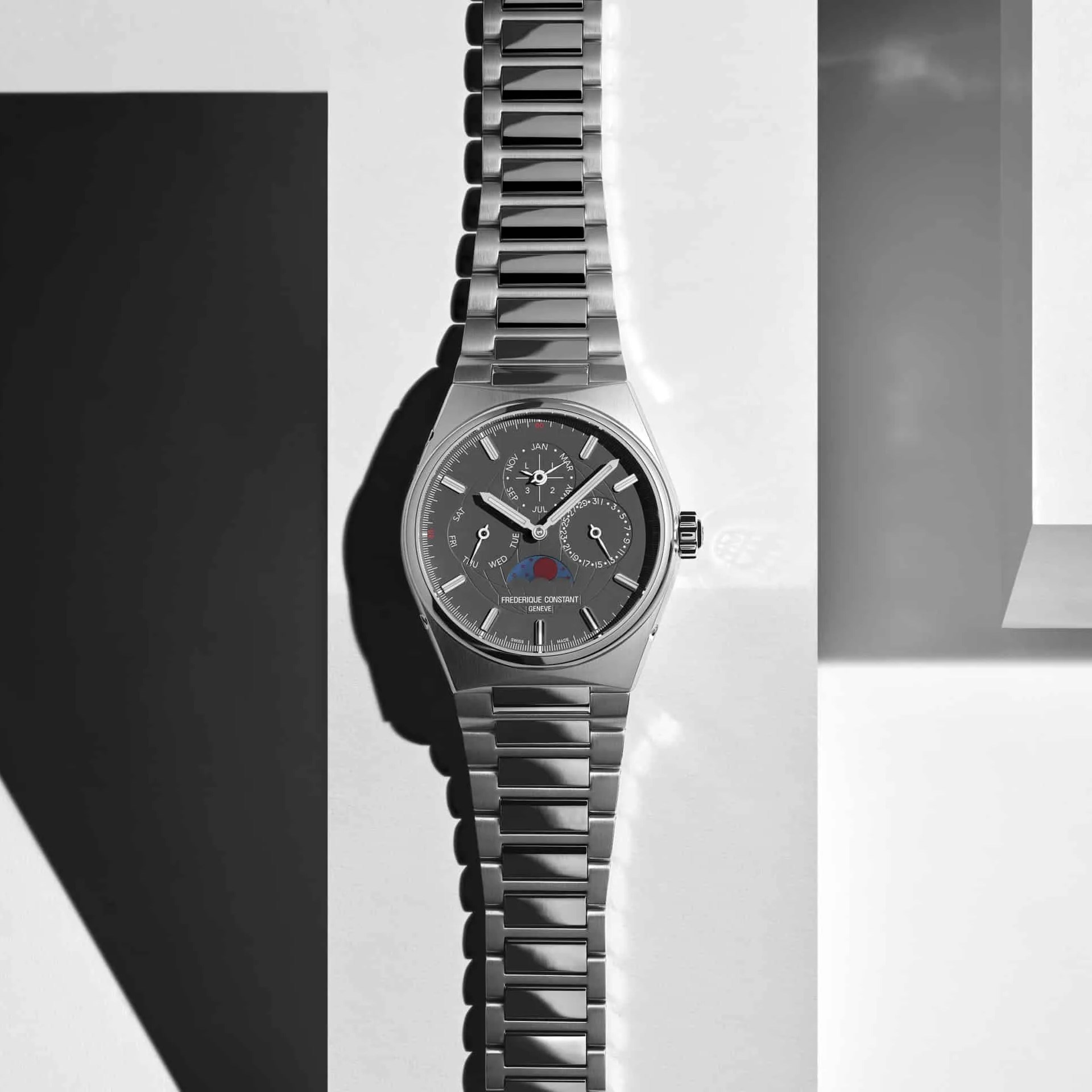 steel watch with geometric shapes