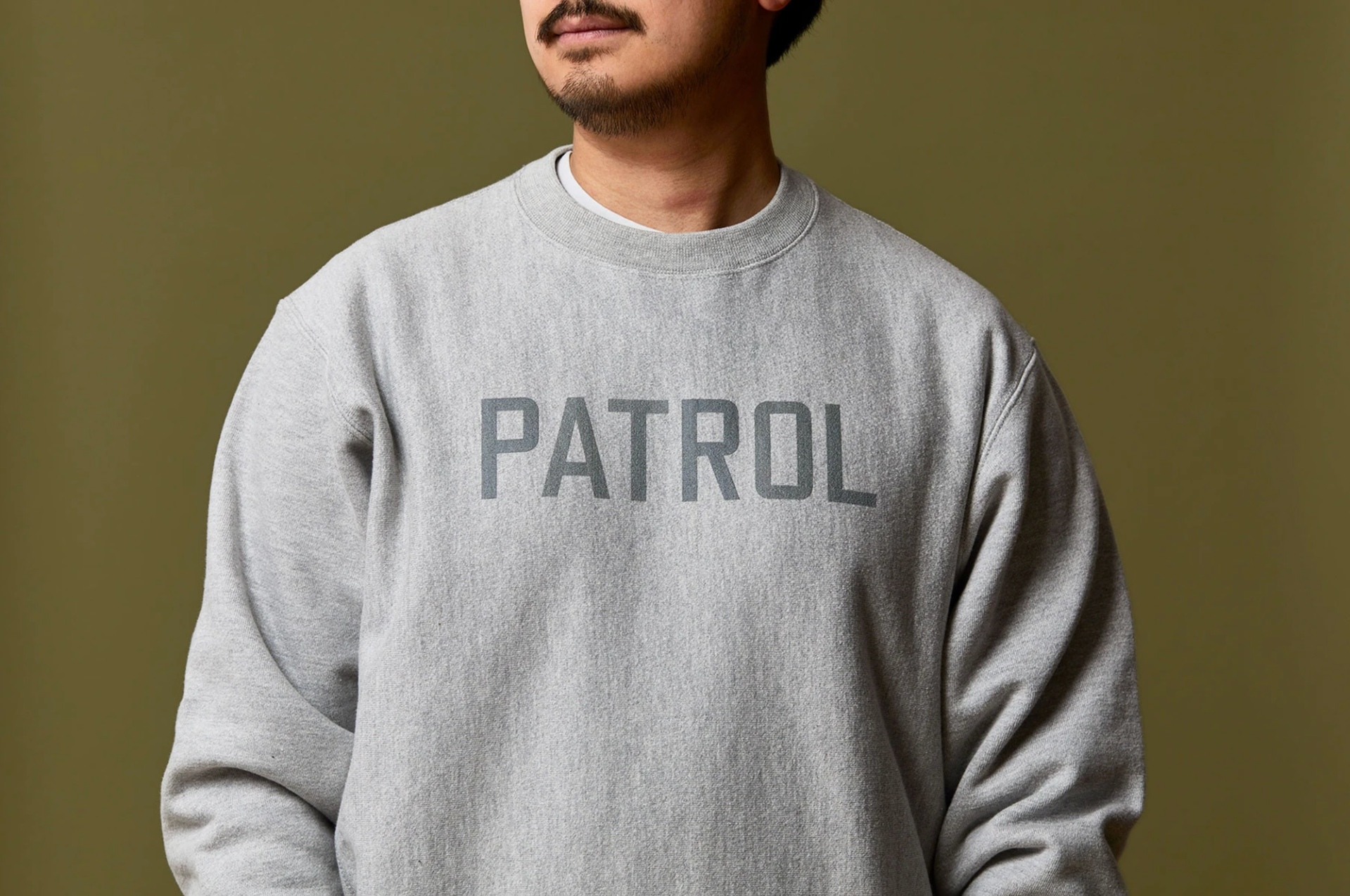 a model wearing a crewneck sweatshirt