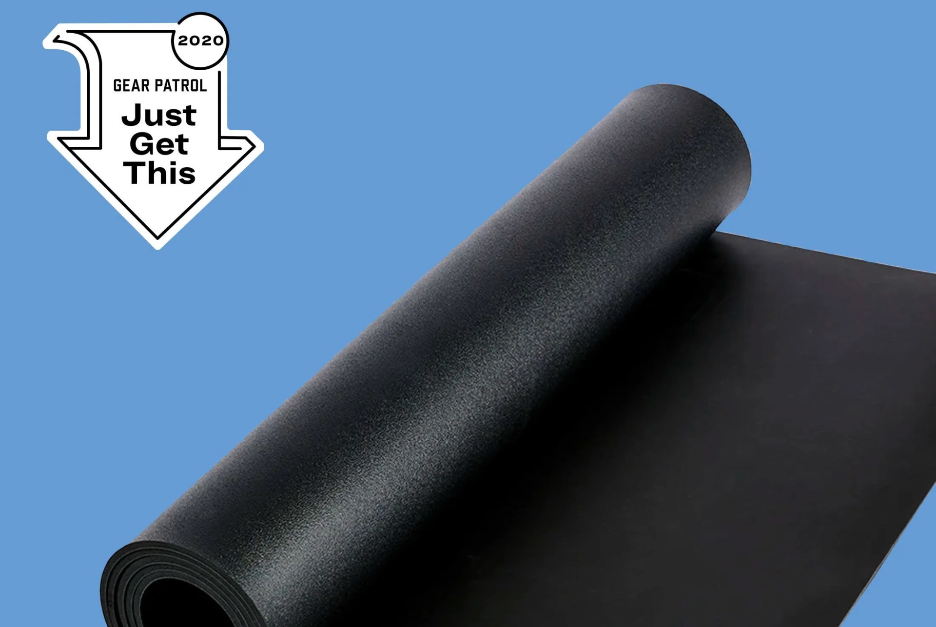 a black yoga mat on a blue background