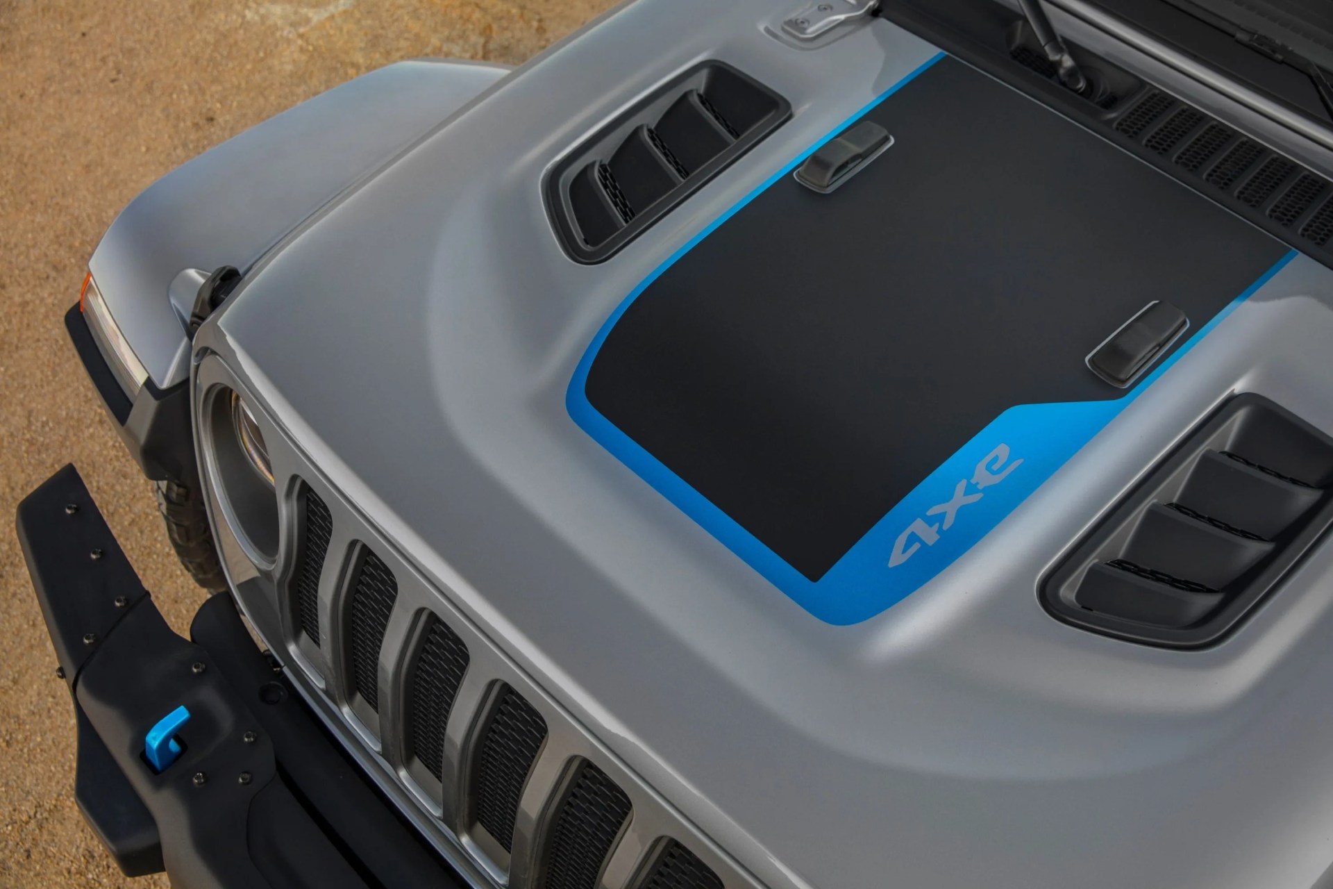 the hood graphic on the 2021 jeep&reg; wrangler rubicon 4xe includes a surf blue accent