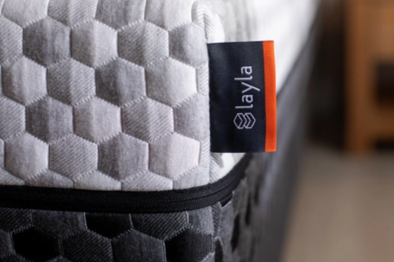 a close up shot of a mattress and the mattress tag