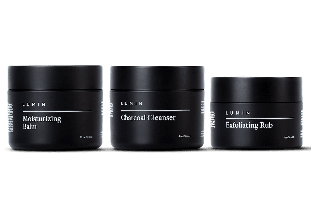 a three product skincare set on a gray background