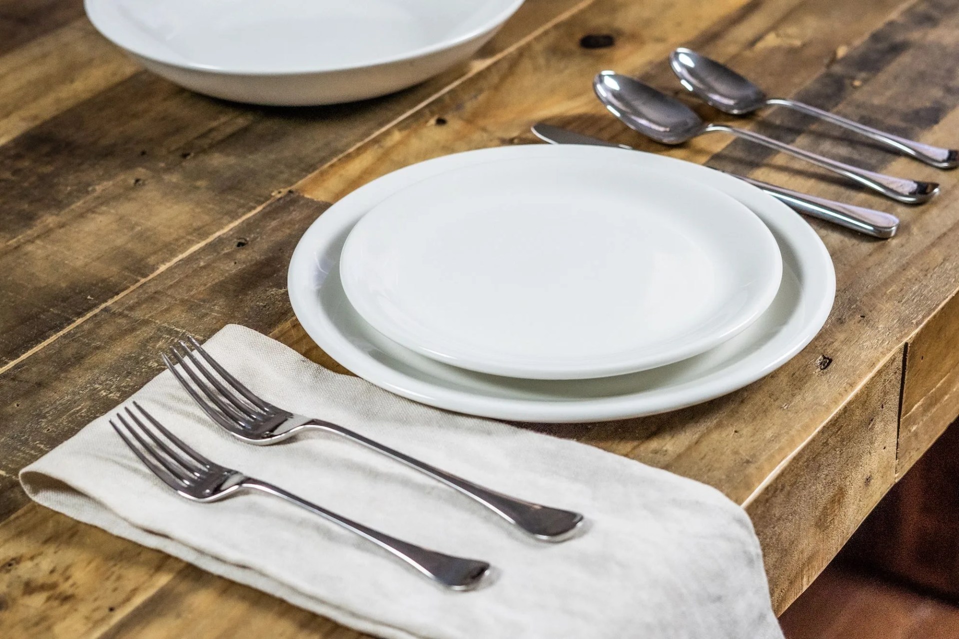 forks on napkin and plates