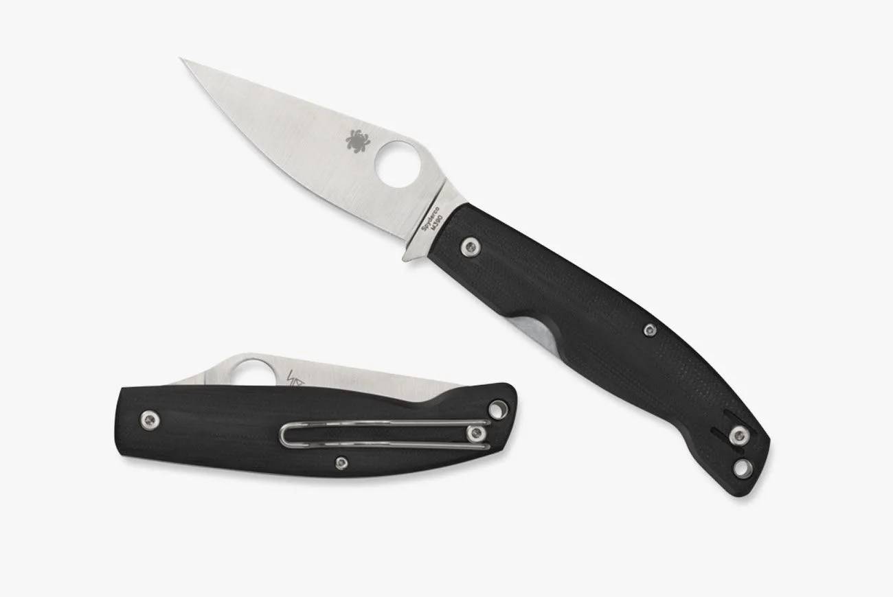 a pocket knife with a black handle