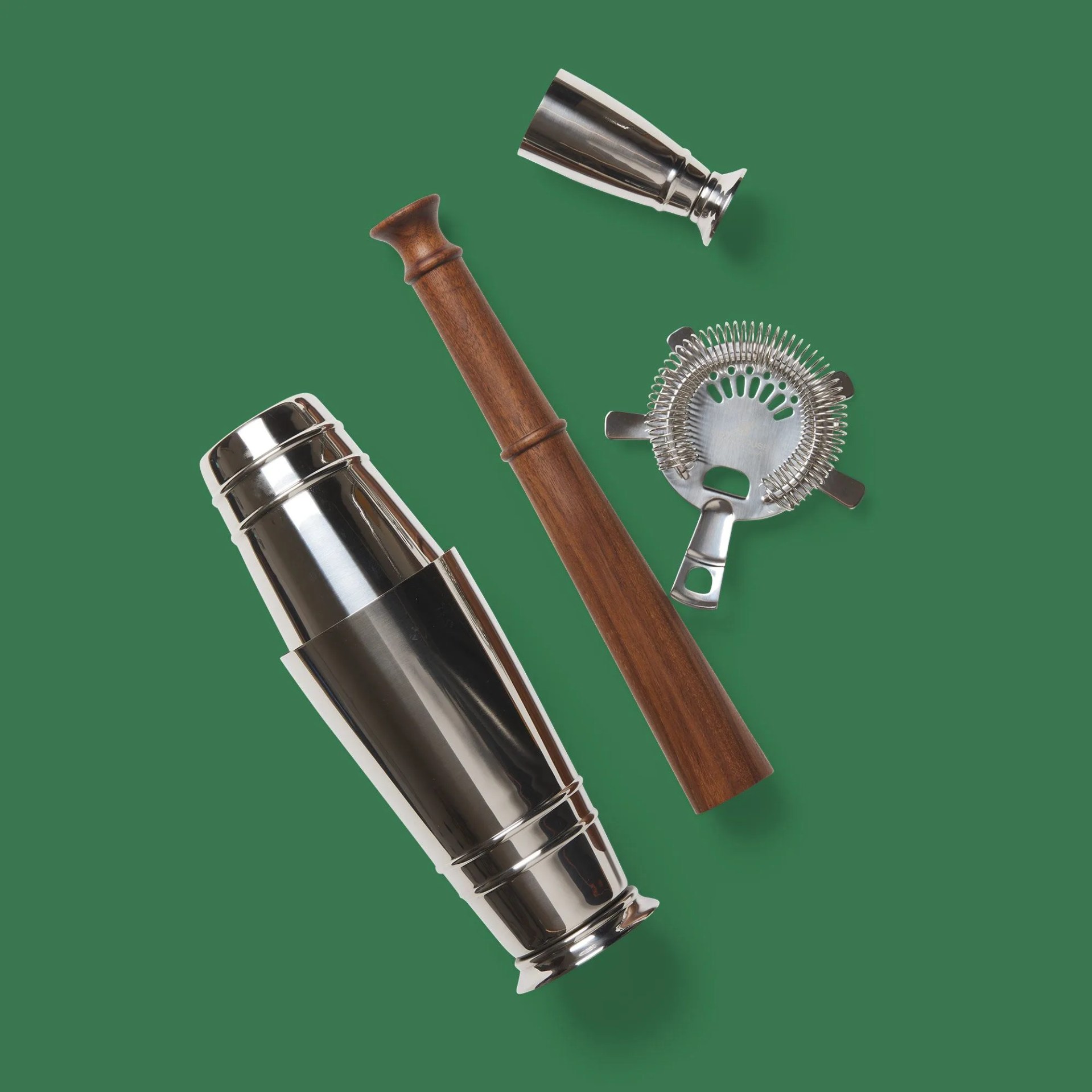 assorted bar tools on green background