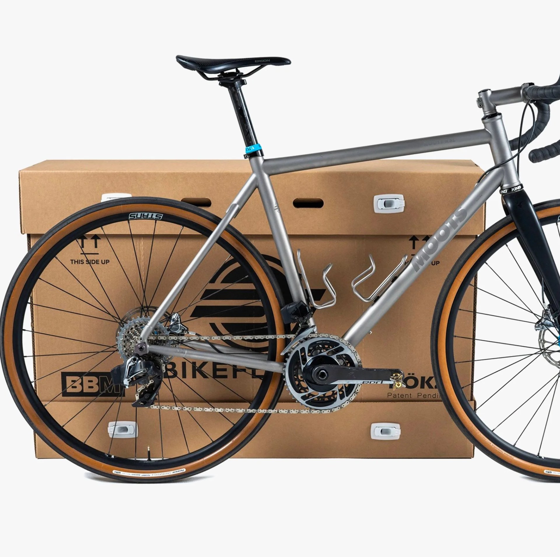a bike next to a big cardboard box