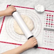 rolling dough on mat