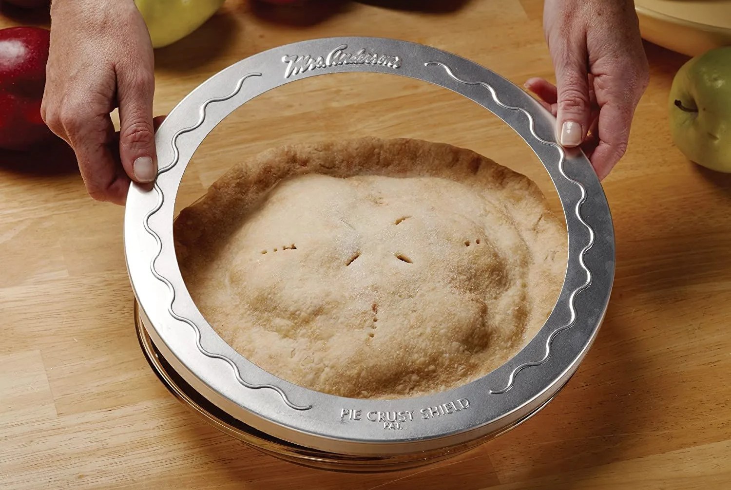 hand holding pie crust protector