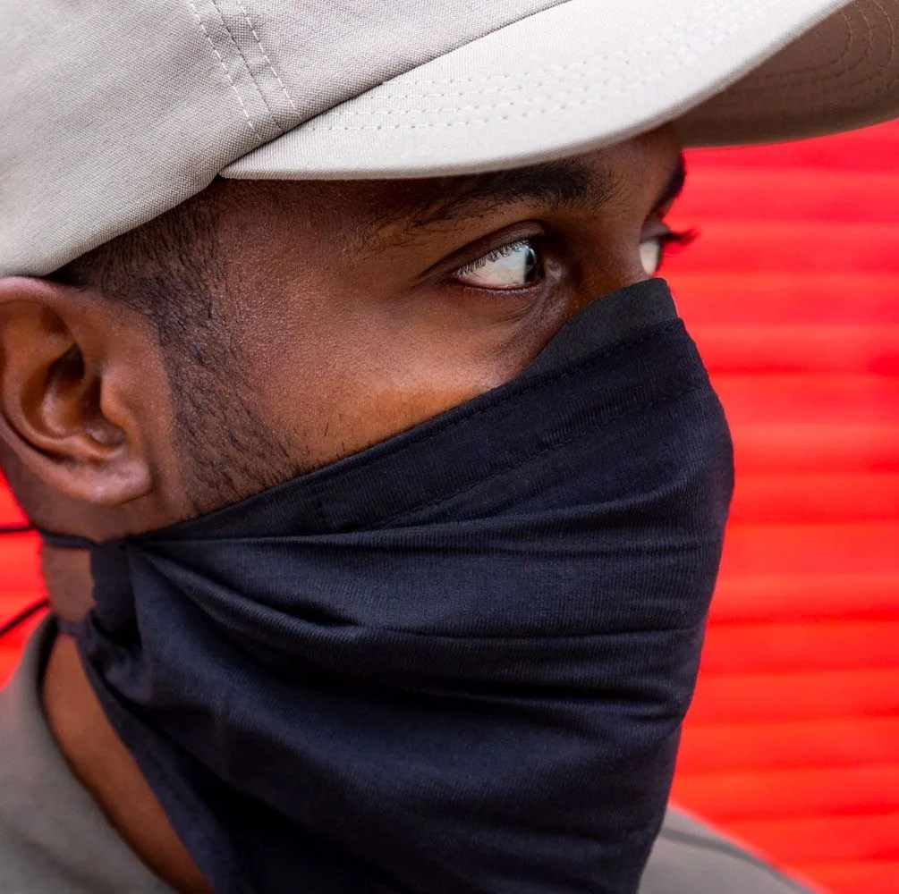 a man wearing a bandana style face mask