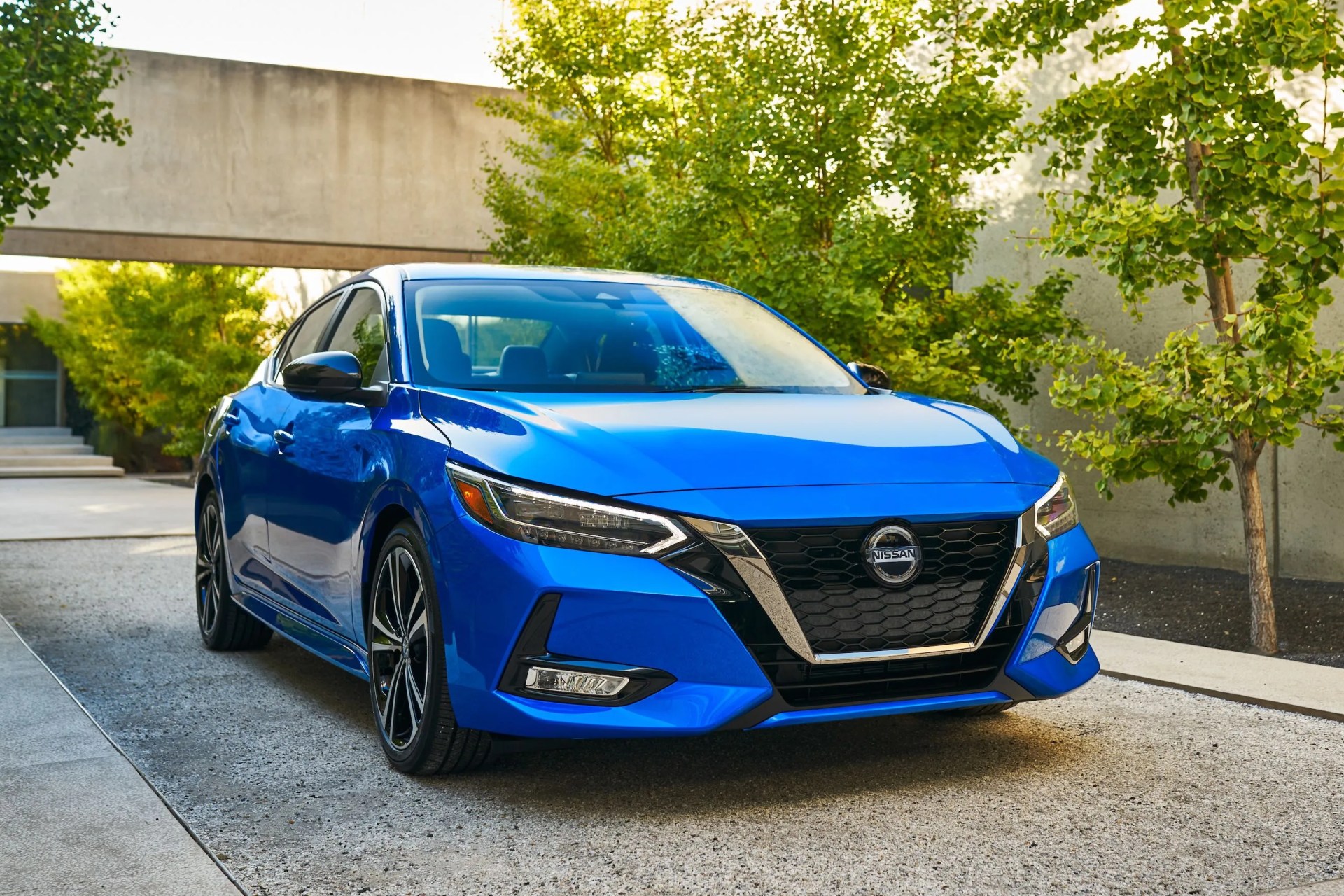 nissan sentra parked in a modernist driveway