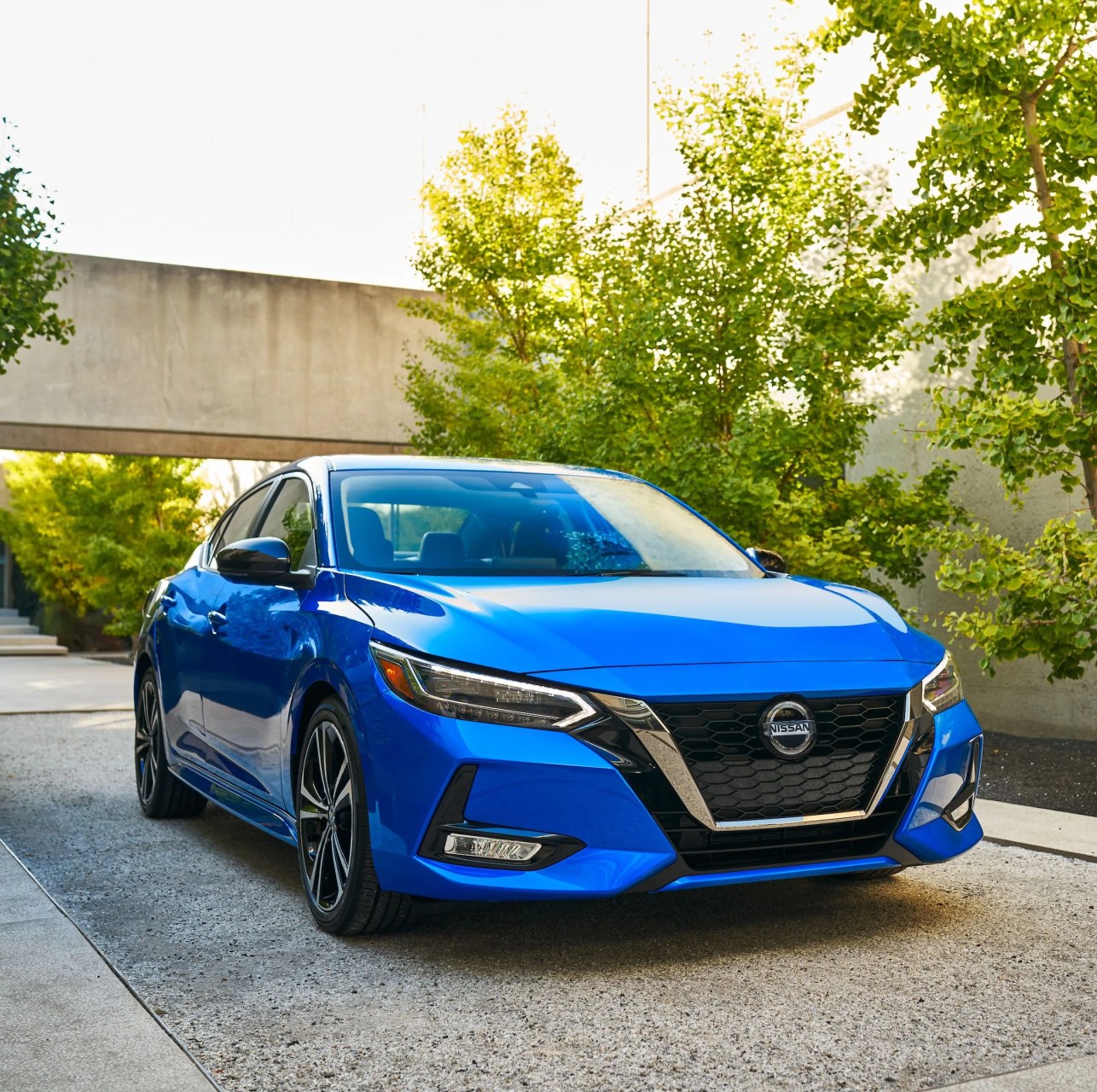 nissan sentra parked in a modernist driveway