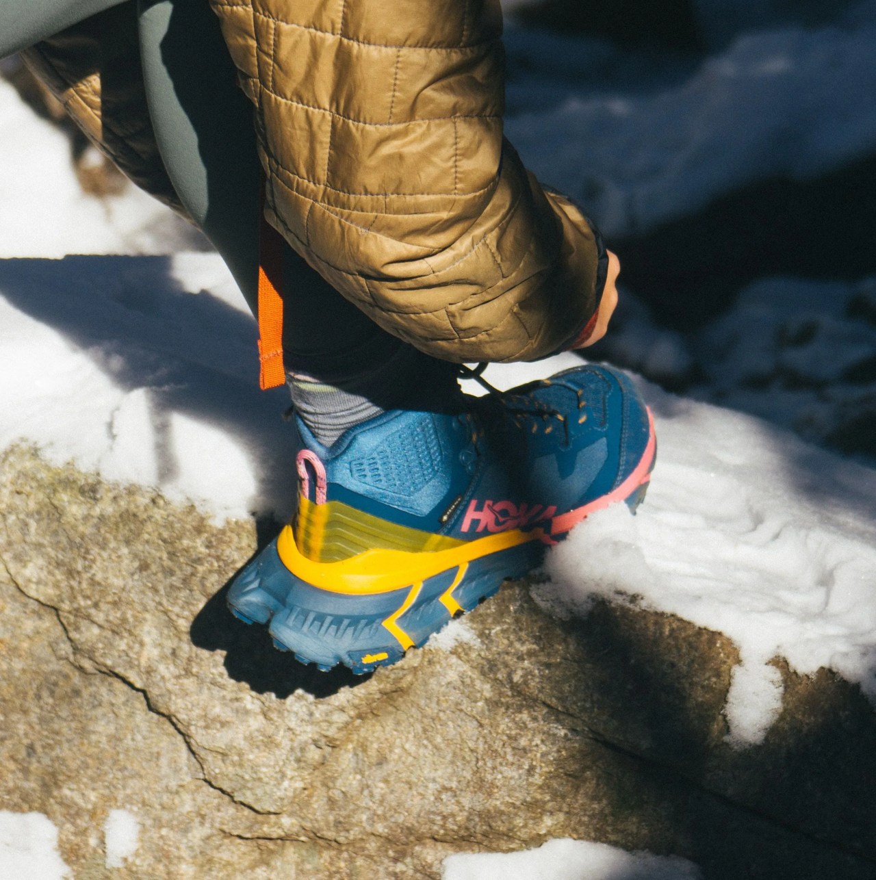 someone tying a hiking boot