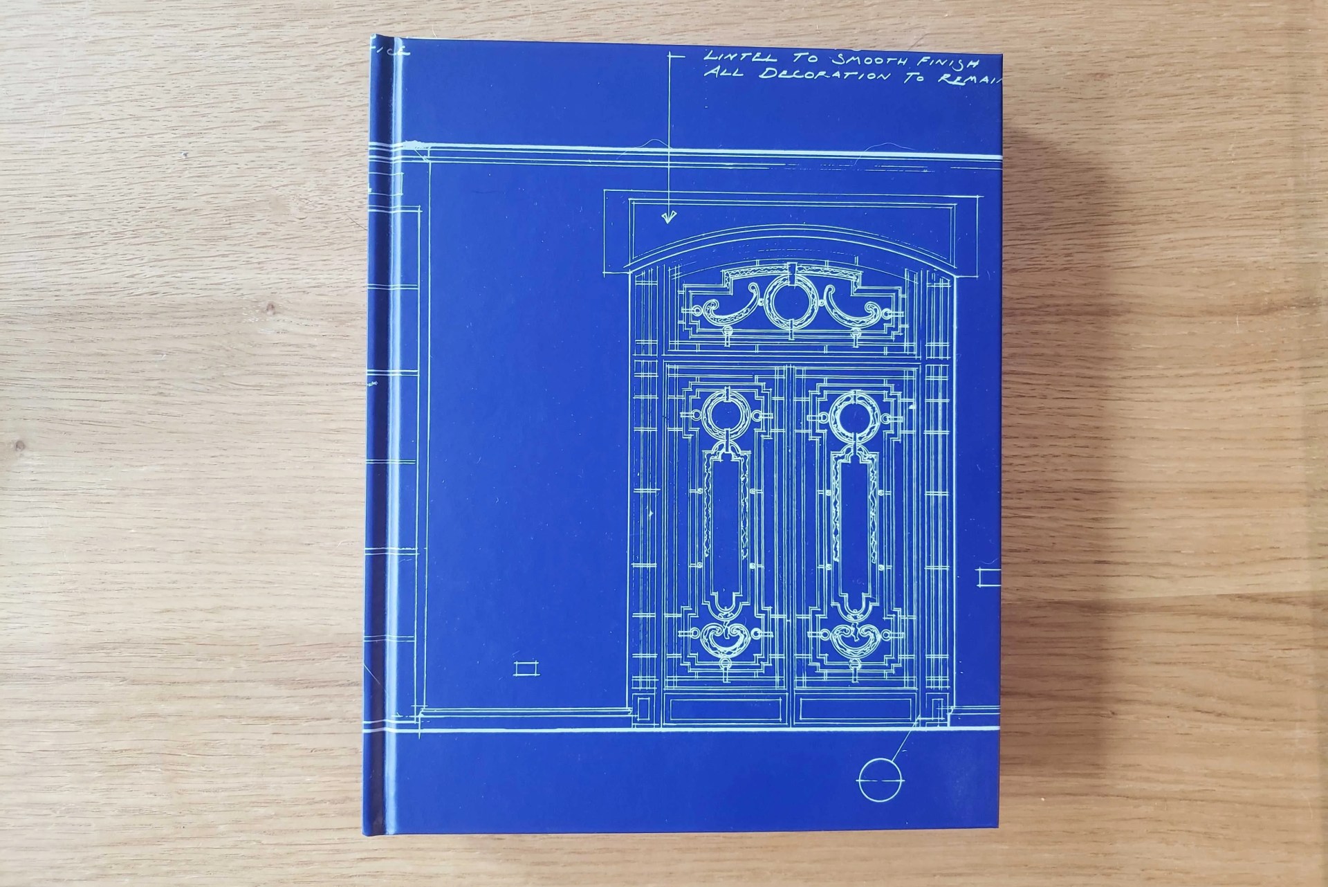blue book against wood background
