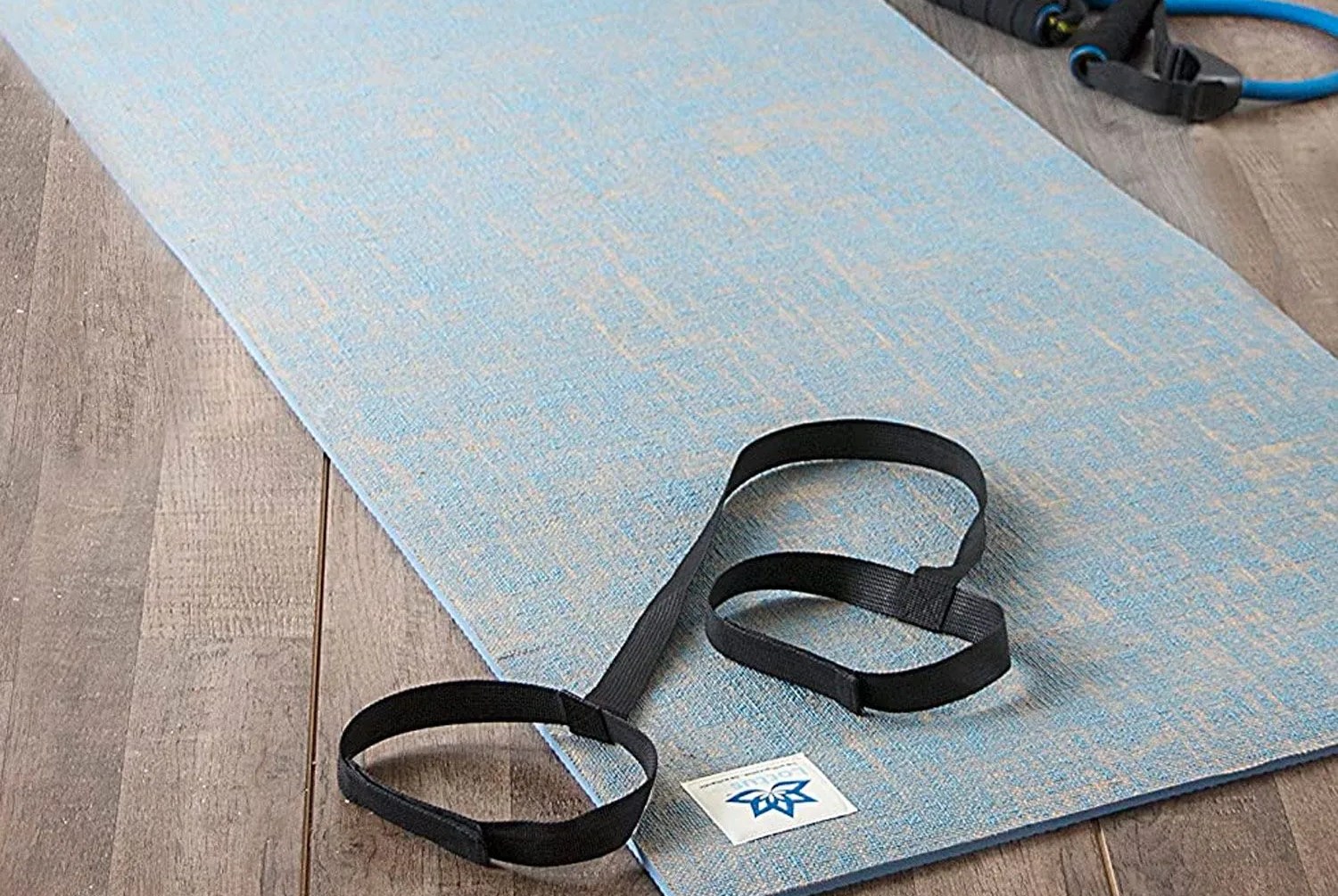 a yoga mat on a wooden floor