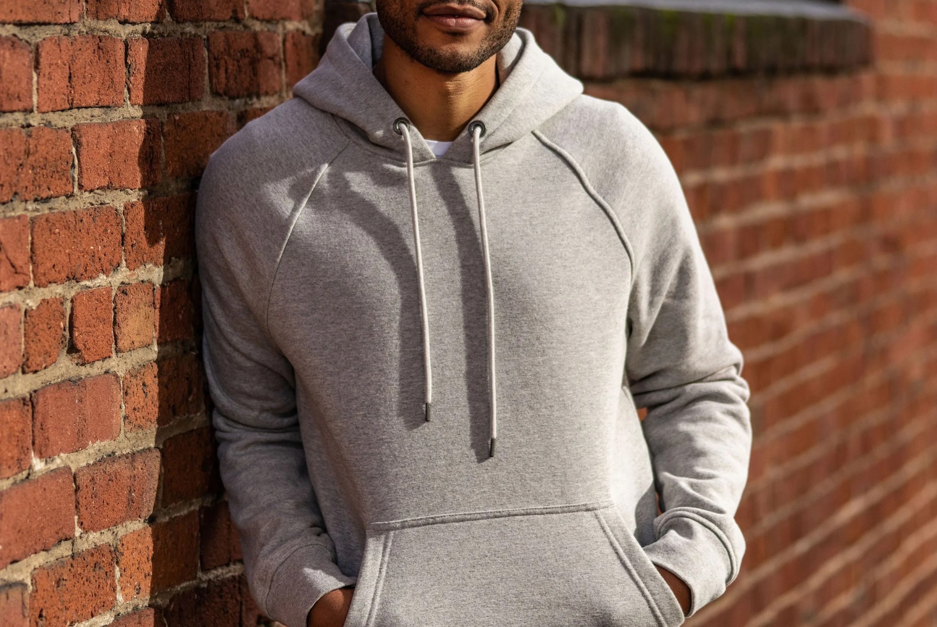 model wearing grey hoodie
