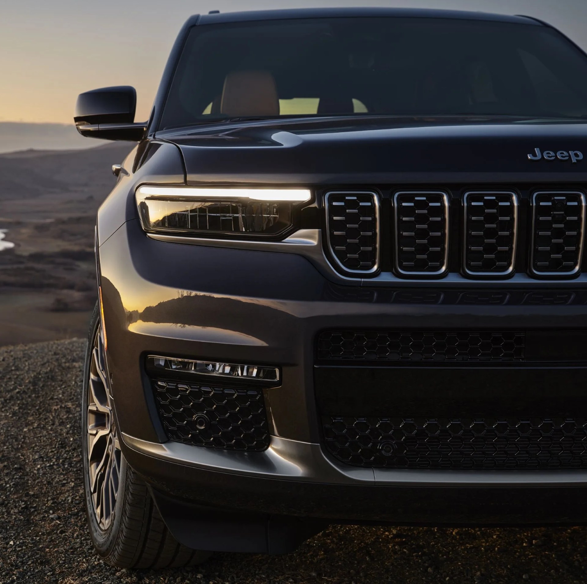 all new 2021 jeep&reg; grand cherokee l summit reserve&nbsp;features all new ultra slim headlamps set into gloss black bezels, along with slim horizontal fog lamps
