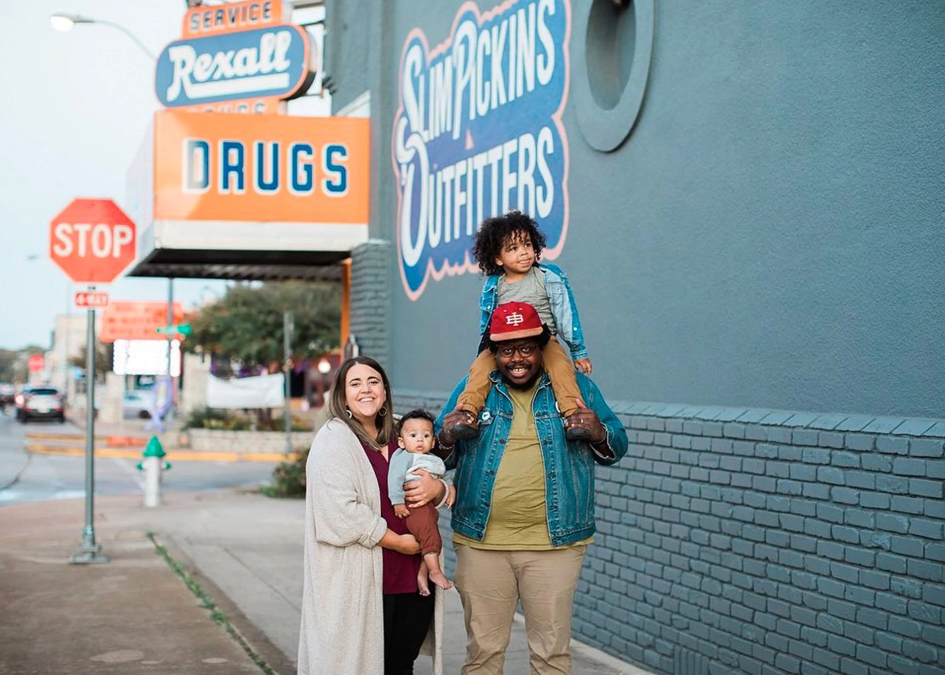 a family standing in front of a gear store