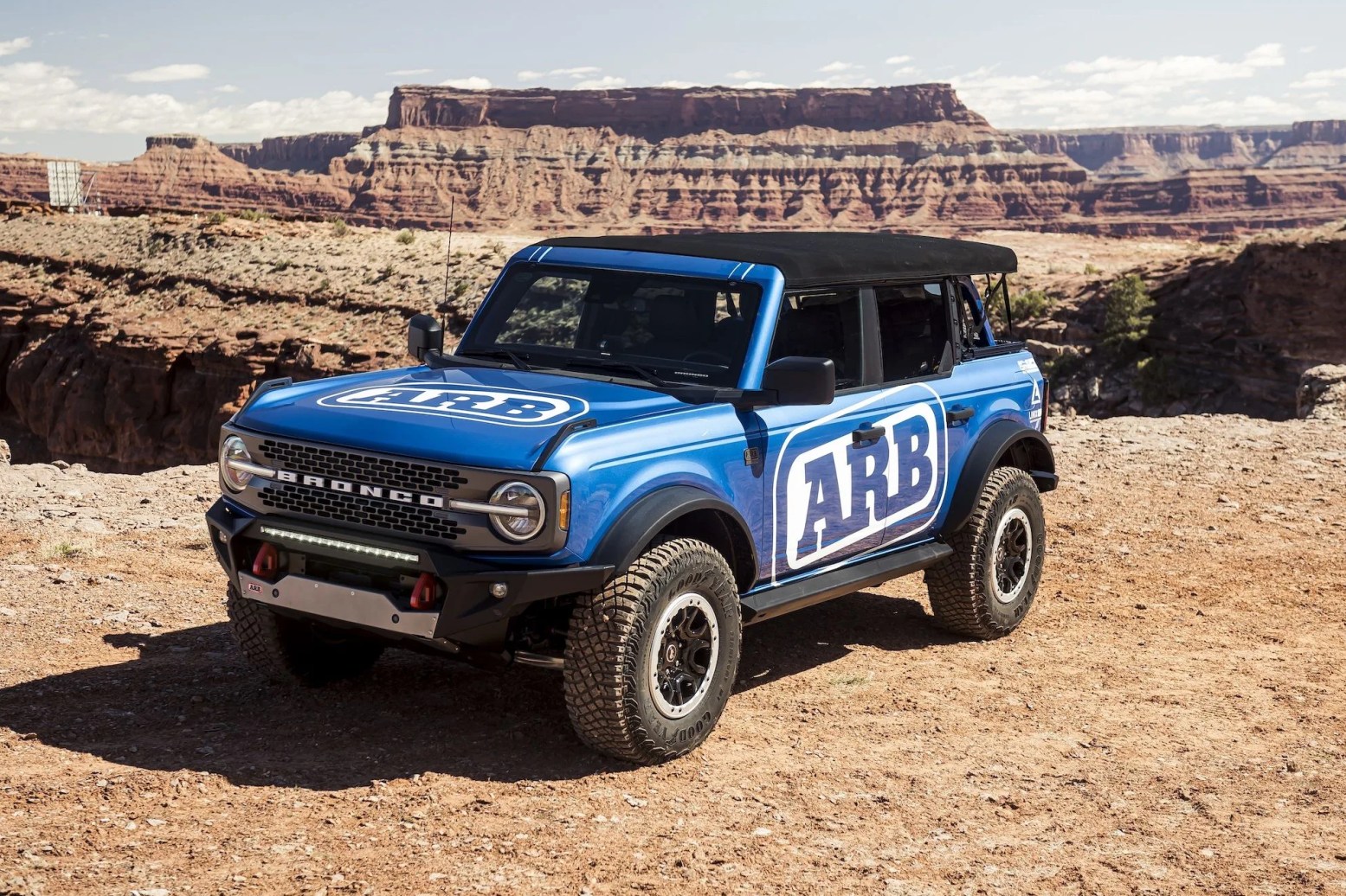the custom bronco four door black diamond series suv features a mix of 4 wheel parts factory brand parts including a modular front bumper, skid plate and winch platform, heavy duty suspension components, custom roof rack and light mounts, plus a smittybilt overhead tent and camping gear, awning and refrigeratorair system it rides on 37 inch bfgoodrich® mud terrain tires mounted to 17 inch method alloy wheels