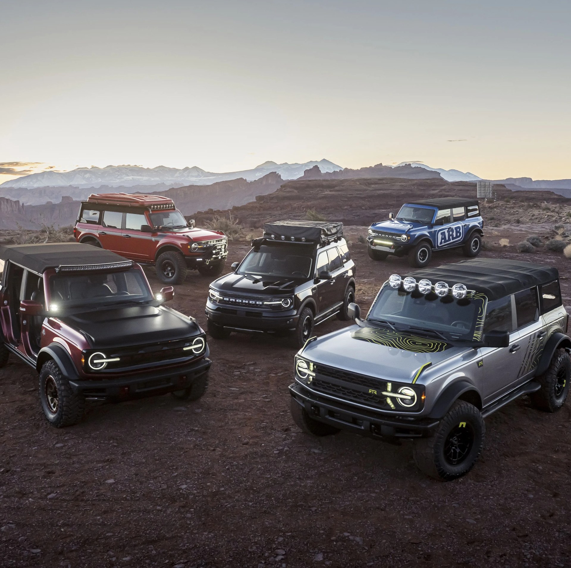 at the easter safari event in moab, utah, off road enthusiasts can drive various trails and see the all new 2021 bronco and bronco sport rugged suvs in person, along with the unveiling of several new custom builds by ford and aftermarket suppliers