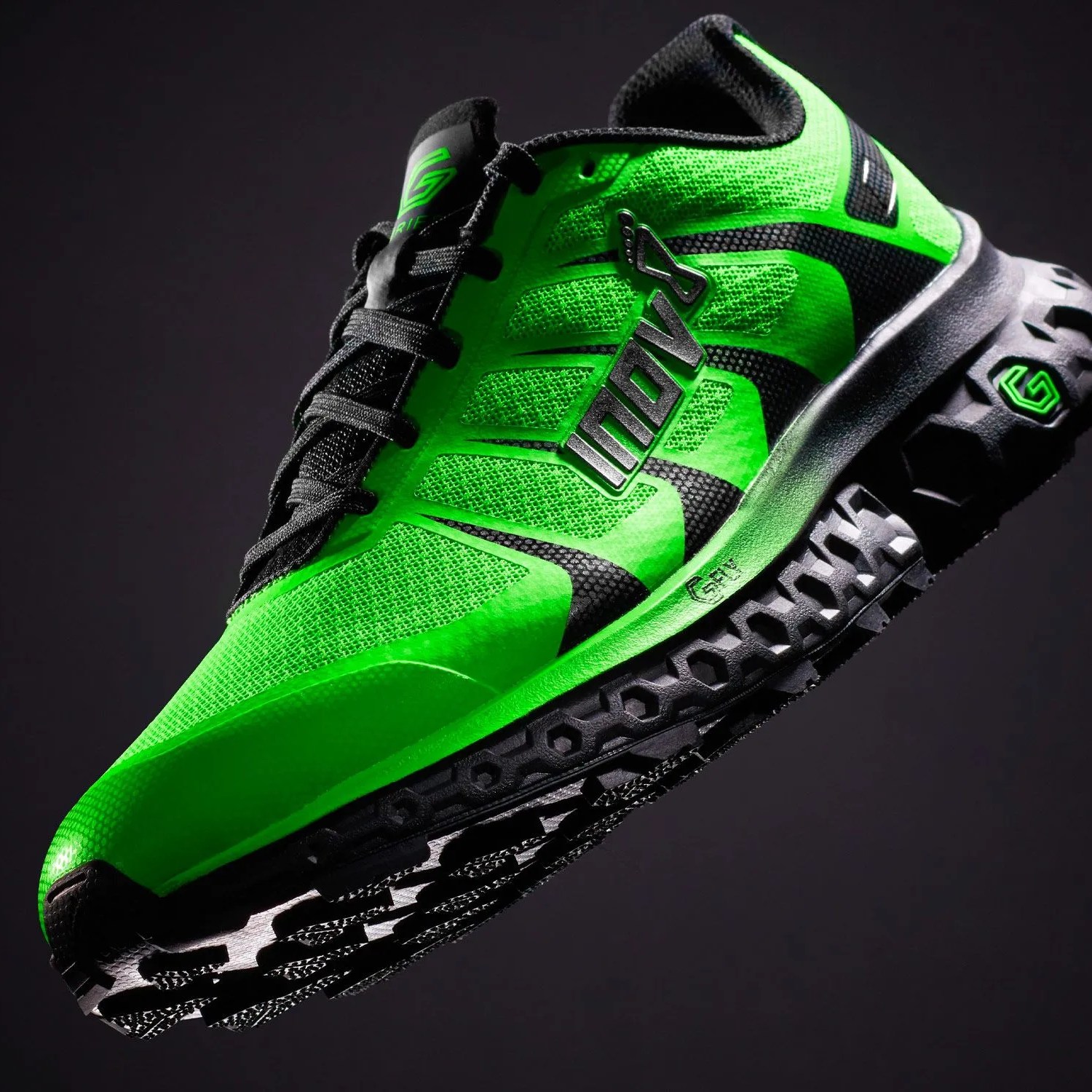 a green and black running shoe